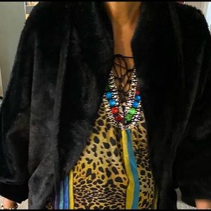 Gently PREOWNED black L ladies cape style coat. With faux fur label